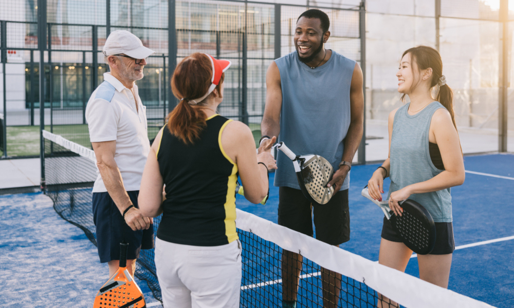 Padel players shaking hands after a friendly game